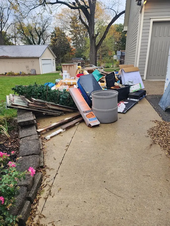 Dumpster being loaded with debris for Residential Dumpster Rental in Cibolo